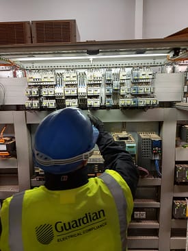 Guardian engineer testing a Tesco distribution board 